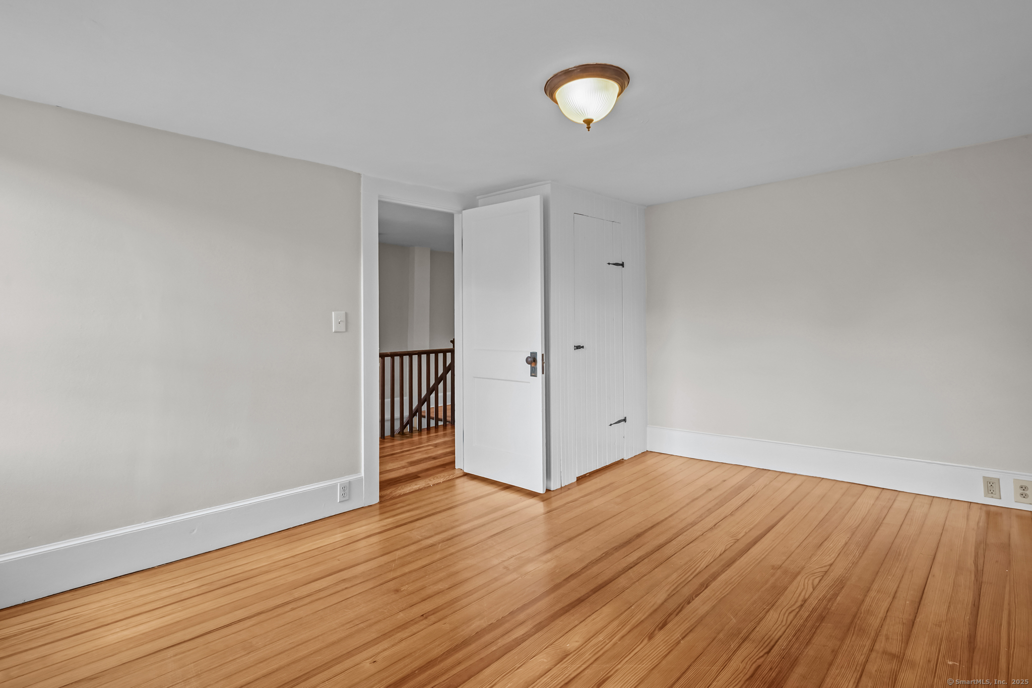 10 North Road Windham, CT 06280 - Photo 31 of 40 an empty room with wooden floor and windows