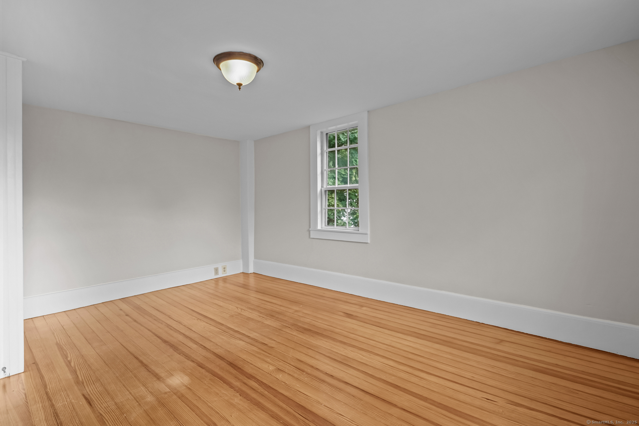 10 North Road Windham, CT 06280 - Photo 32 of 40 a view of empty room with wooden floor
