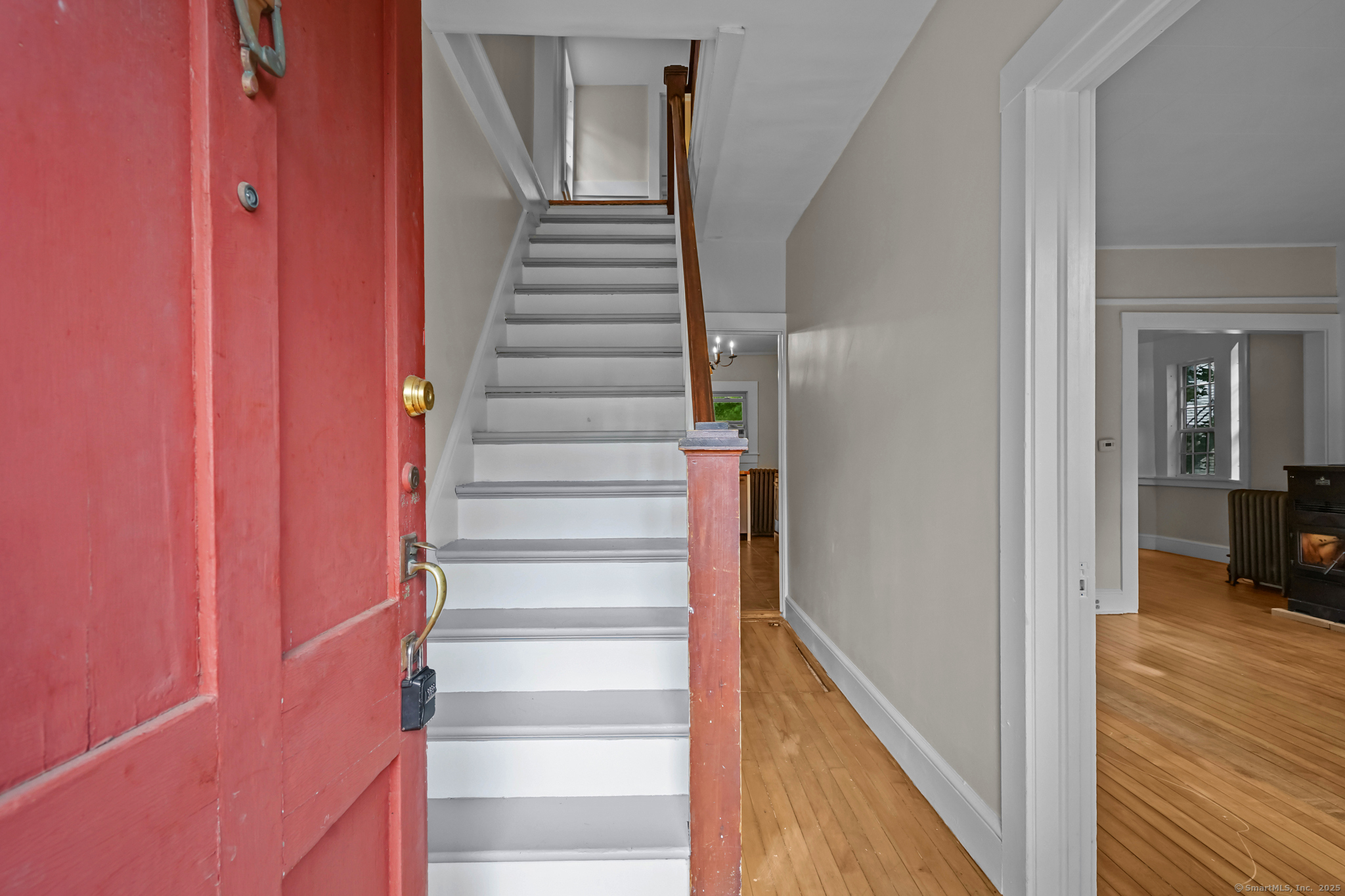 10 North Road Windham, CT 06280 - Photo 5 of 40 a view of a hallway with wooden floor and entryway