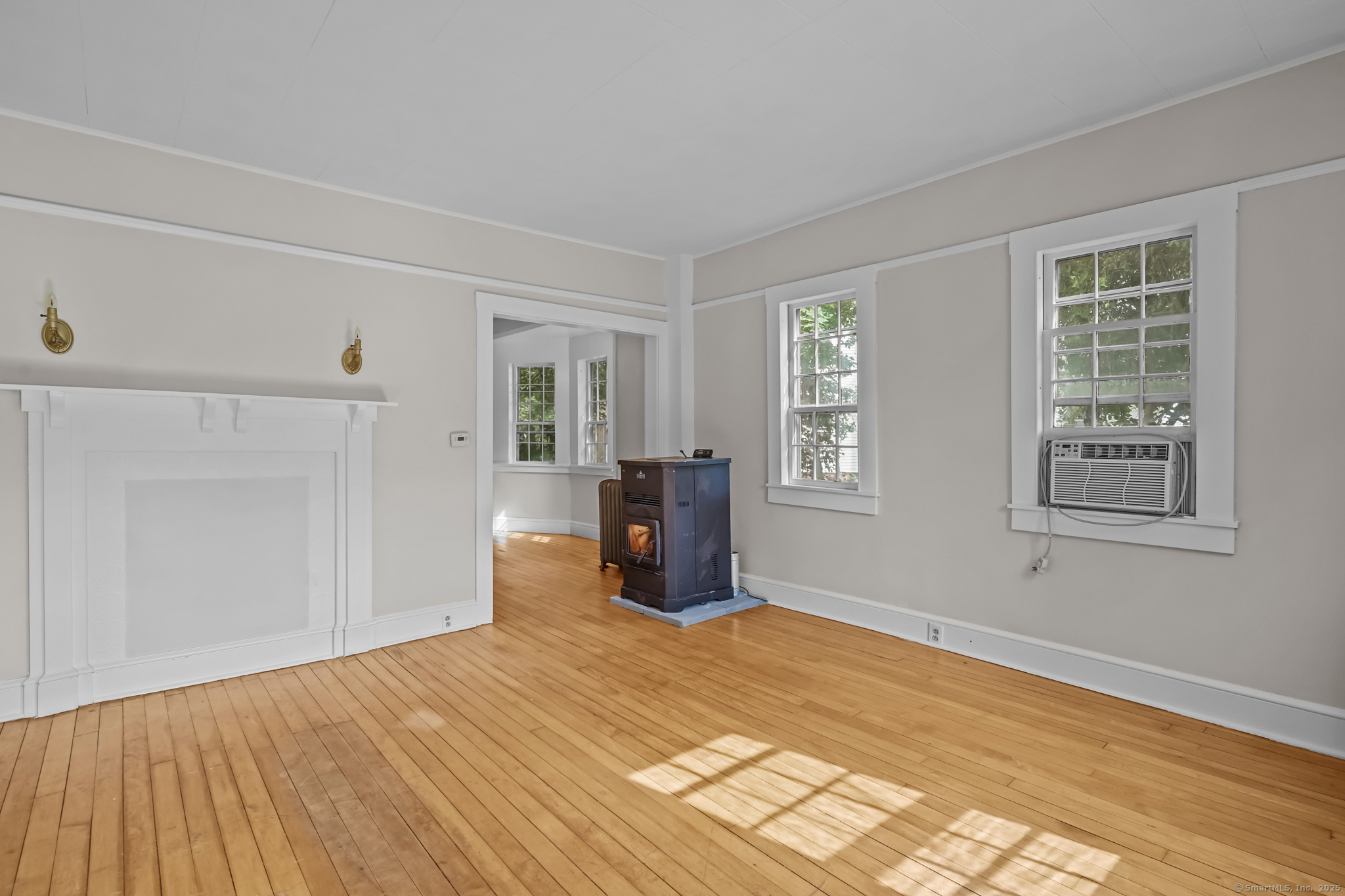 10 North Road Windham, CT 06280 - Photo 6 of 40 a bedroom with a bed and wooden floor