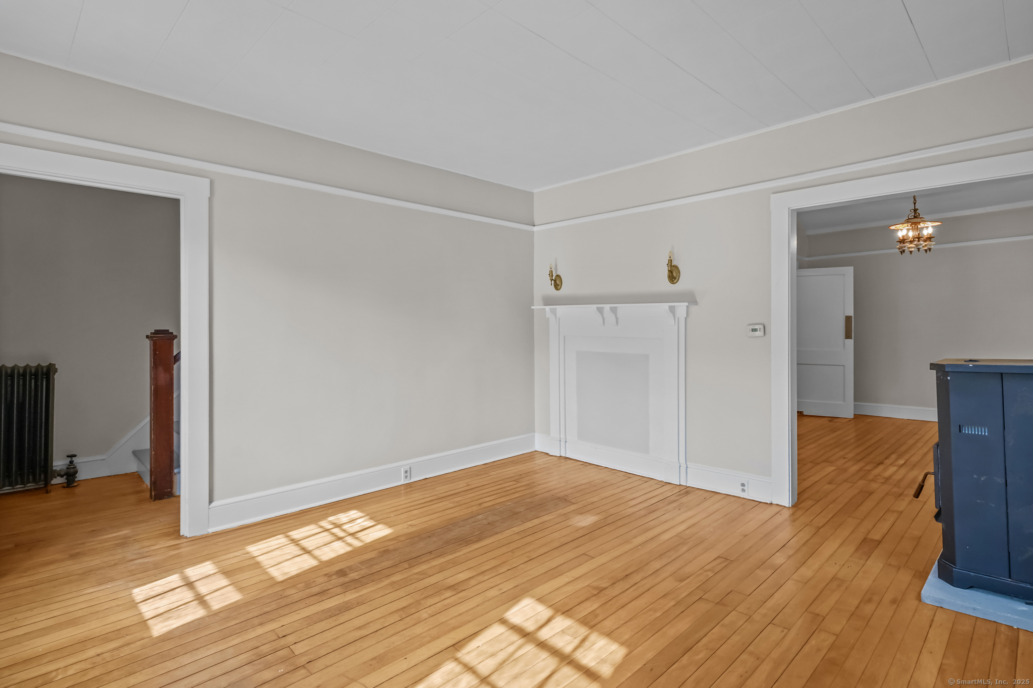 10 North Road Windham, CT 06280 - Photo 8 of 40 a view of empty room with wooden floor