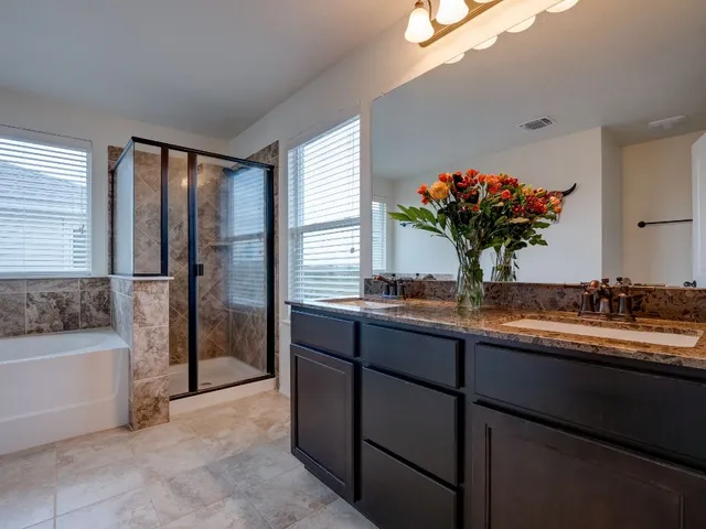 a view of kitchen with sink and refrigerator