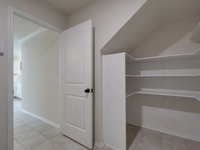 a view of an empty walk in closet