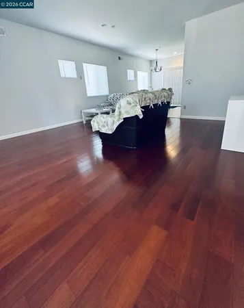 a living room with hard wood flooring