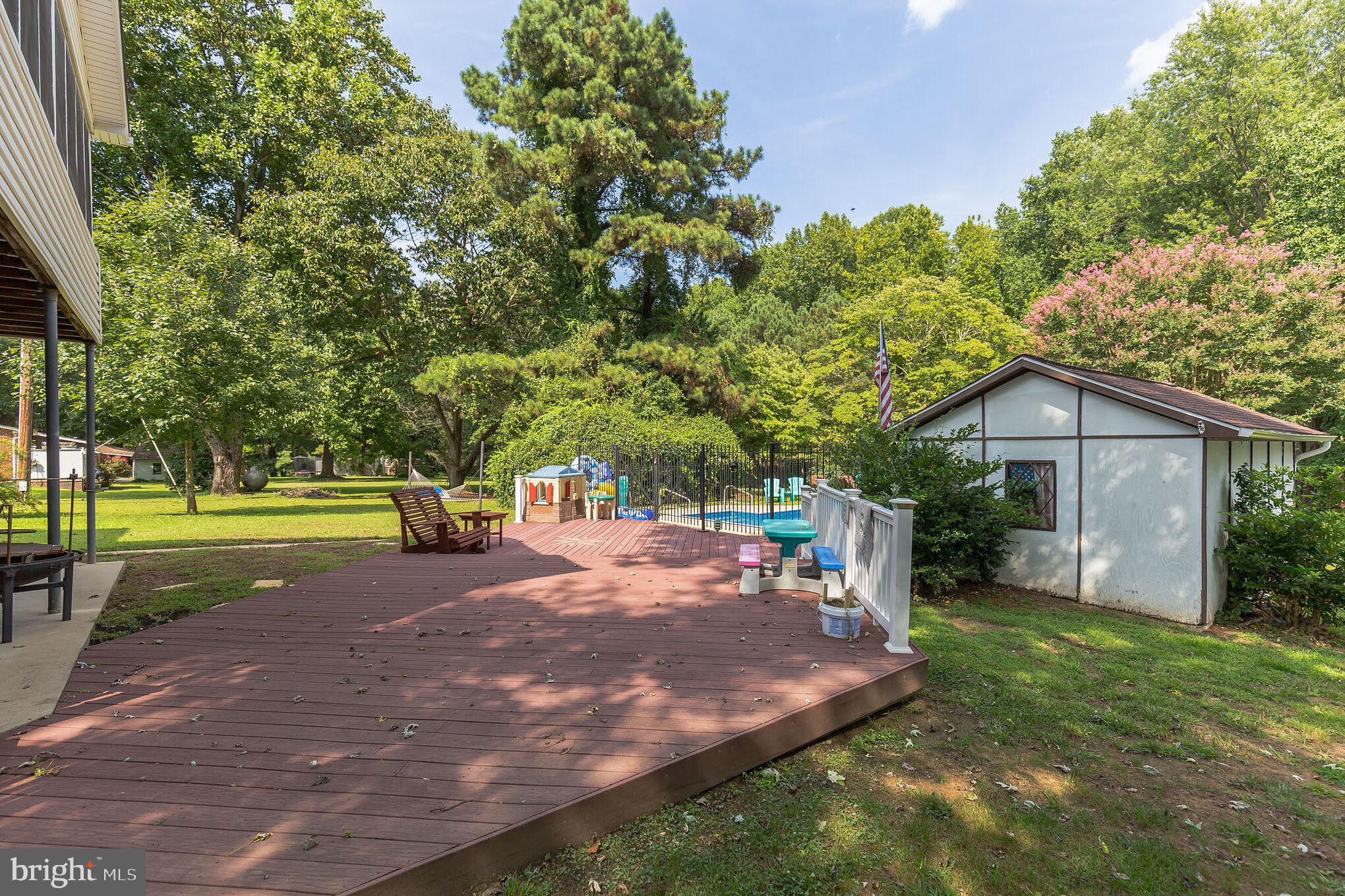 3130 Holland Cliffs Road Huntingtown, MD 20639 - Photo 1 of 33 Large deck off leading to the pool