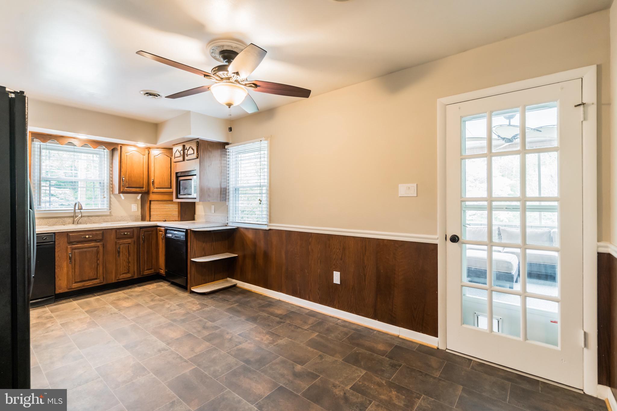 3130 Holland Cliffs Road Huntingtown, MD 20639 - Photo 9 of 33 Door leads to sunroom area that overlooks pool