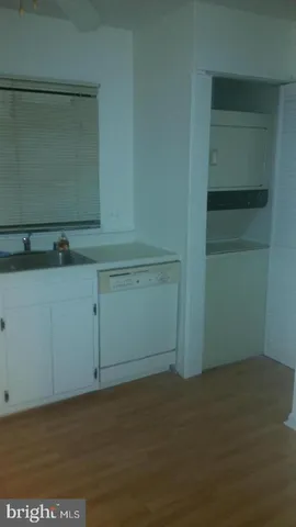 a room with a cabinets and a window