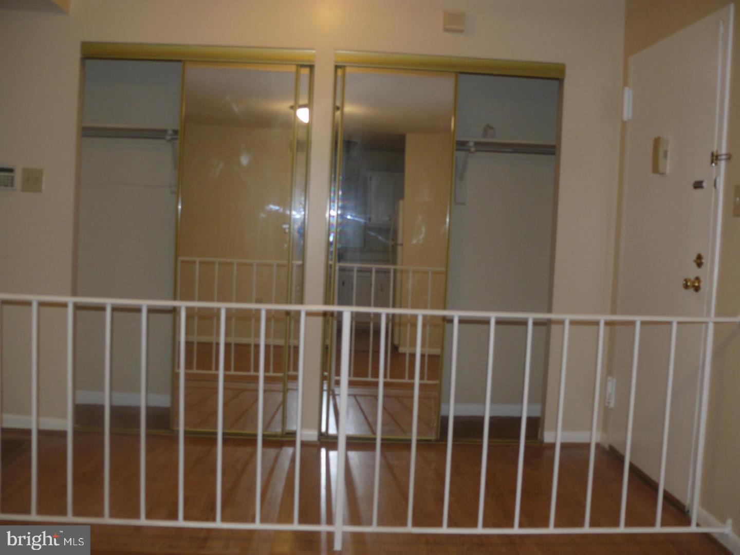 15712 Dorset Road, Unit T3 Laurel, MD 20707 - Photo 4 of 19 a view of staircase with railing and a window