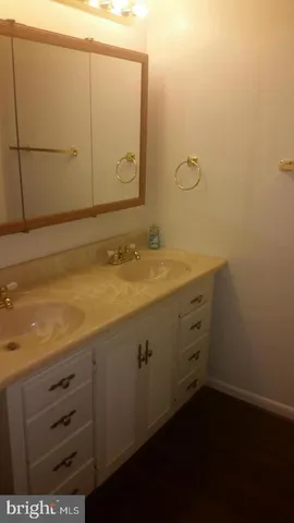 a bathroom with a sink and vanity