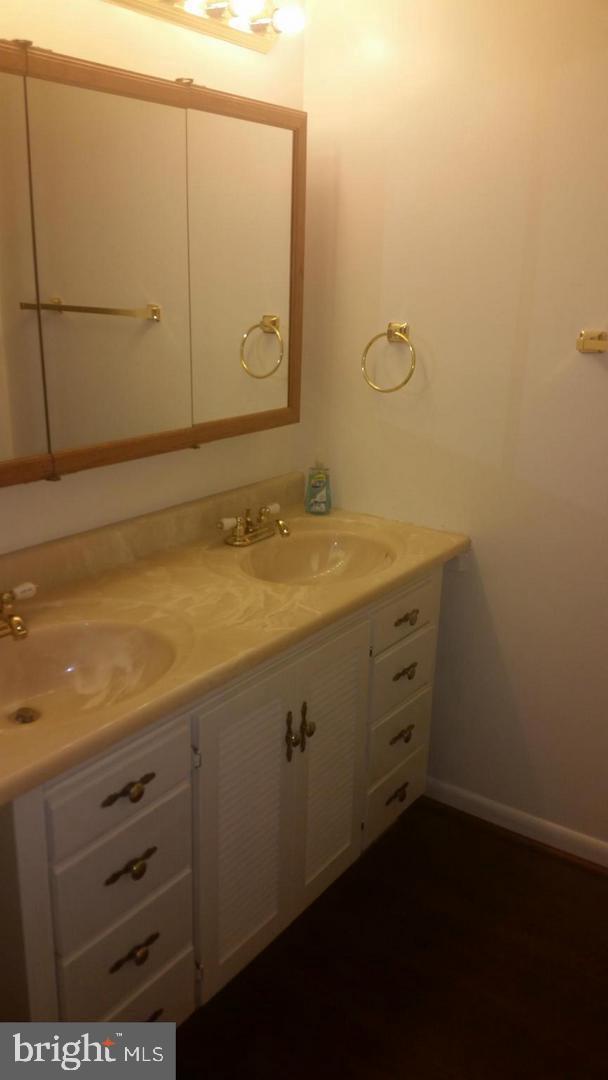 15712 Dorset Road, Unit T3 Laurel, MD 20707 - Photo 6 of 19 a bathroom with a sink and vanity