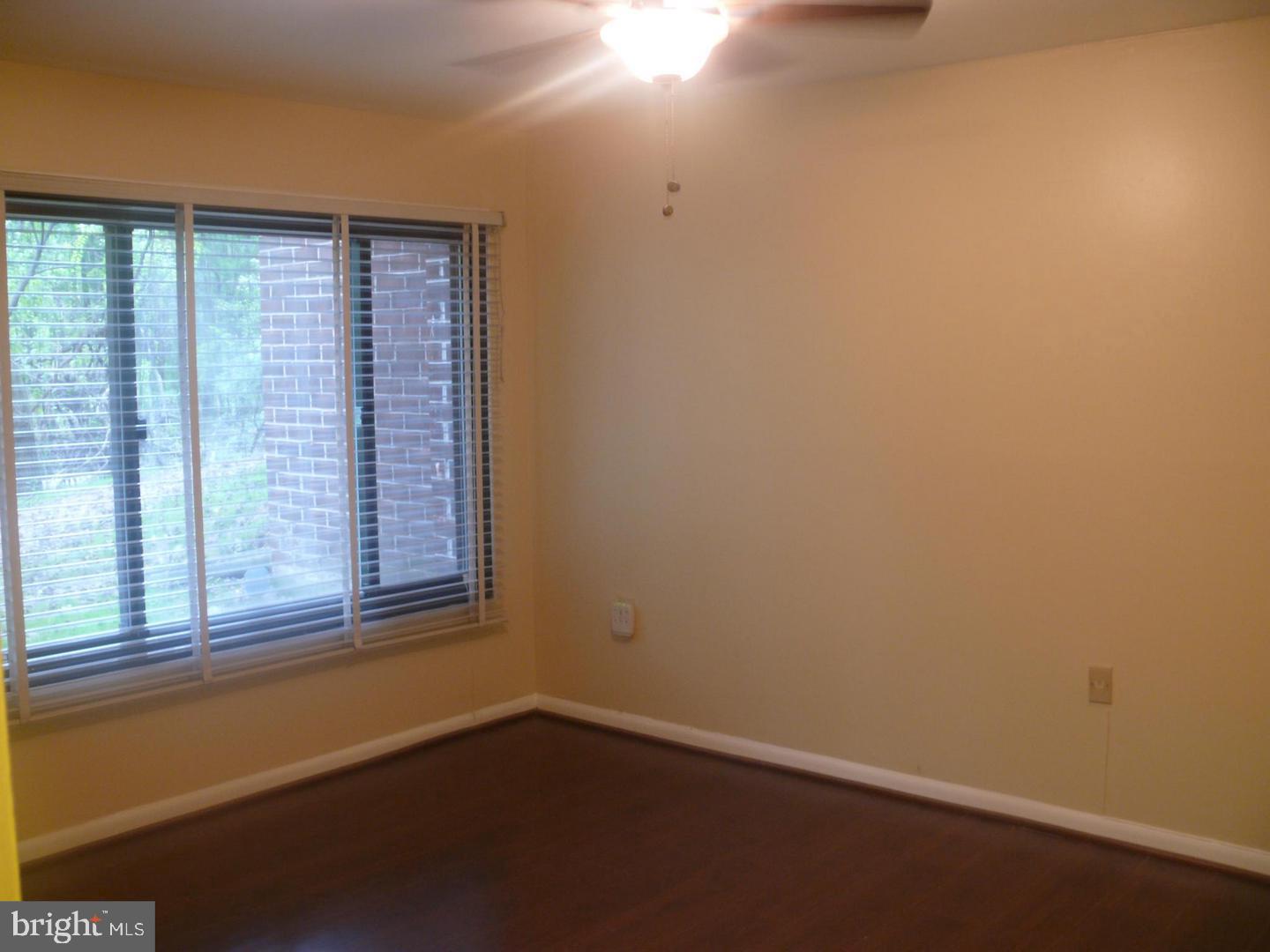 15712 Dorset Road, Unit T3 Laurel, MD 20707 - Photo 10 of 19 an empty room with a window
