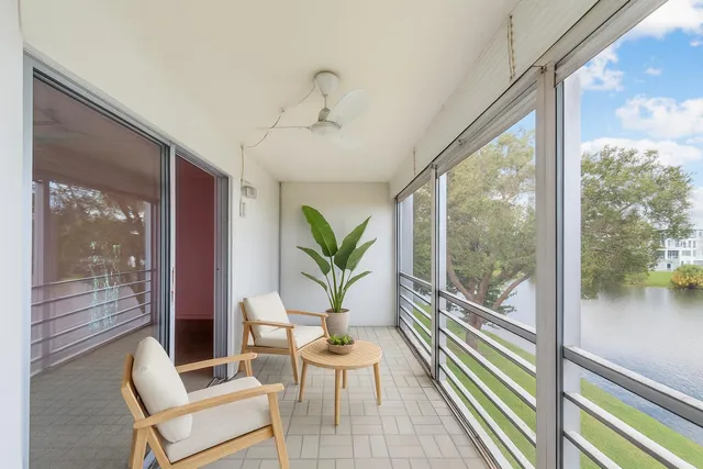 a view of a balcony with furniture