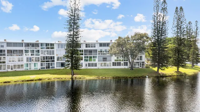 a view of a lake with building in front of it