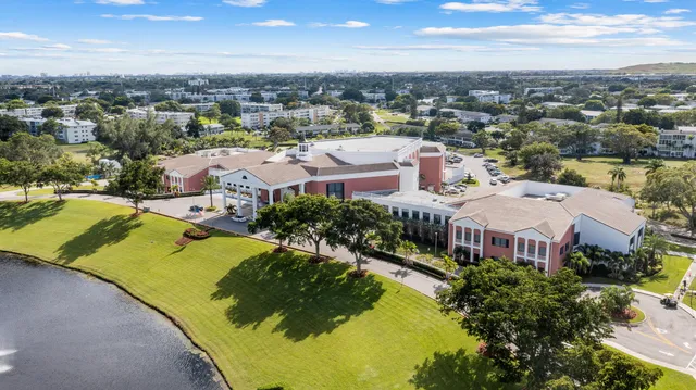 an aerial view of residential houses with outdoor space and river view