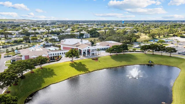 an aerial view of a house with a swimming pool yard and outdoor seating