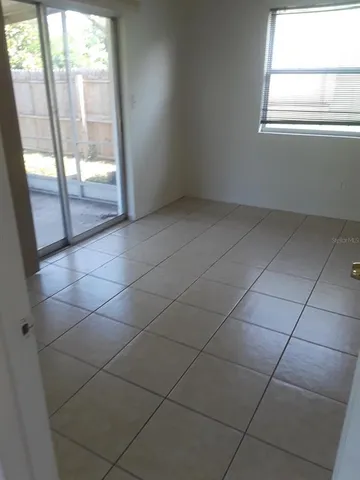 a view of an empty room with a window