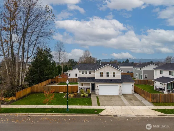 a view of a big yard in front of the house