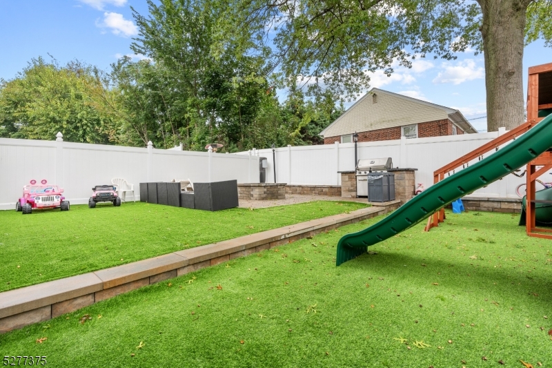 38 Center Street Belleville, NJ 07109 - Photo 11 of 22 a view of a house with a yard and sitting area