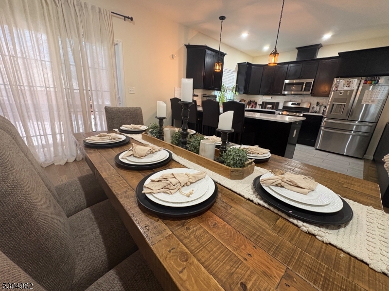 38 Center Street Belleville, NJ 07109 - Photo 20 of 22 a kitchen with a dining table and chairs