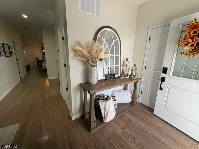 a kitchen with a sink stainless steel appliances and cabinets