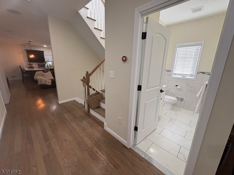 38 Center Street Belleville, NJ 07109 - Photo 21 of 22 a view of a hallway view with wooden floor and staircase