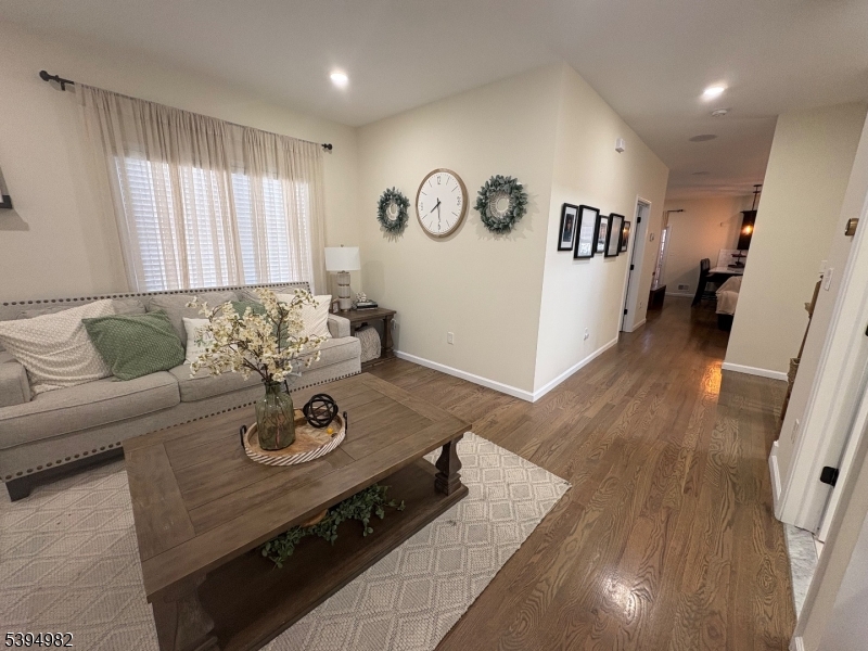 38 Center Street Belleville, NJ 07109 - Photo 4 of 22 a living room with furniture and wooden floor