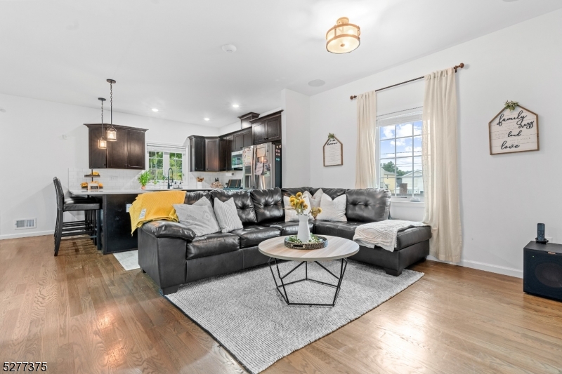 38 Center Street Belleville, NJ 07109 - Photo 7 of 22 a living room with furniture and a flat screen tv