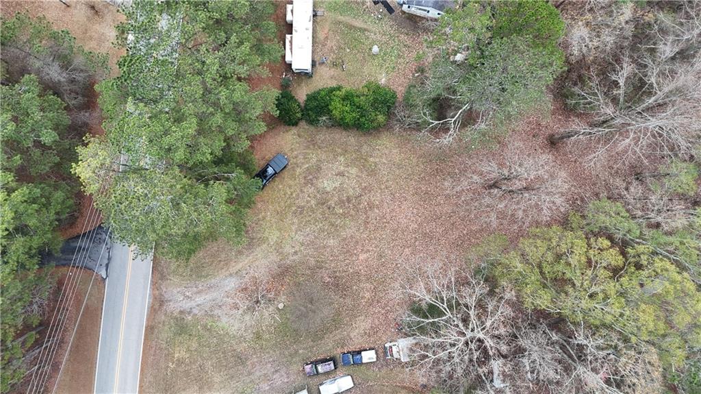 7307 Williams Road Flowery Branch, GA 30542 - Photo 15 of 30 a view of a yard with plants and trees
