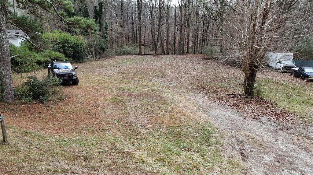 7307 Williams Road Flowery Branch, GA 30542 - Photo 2 of 30 a backyard of a house with lots of green space