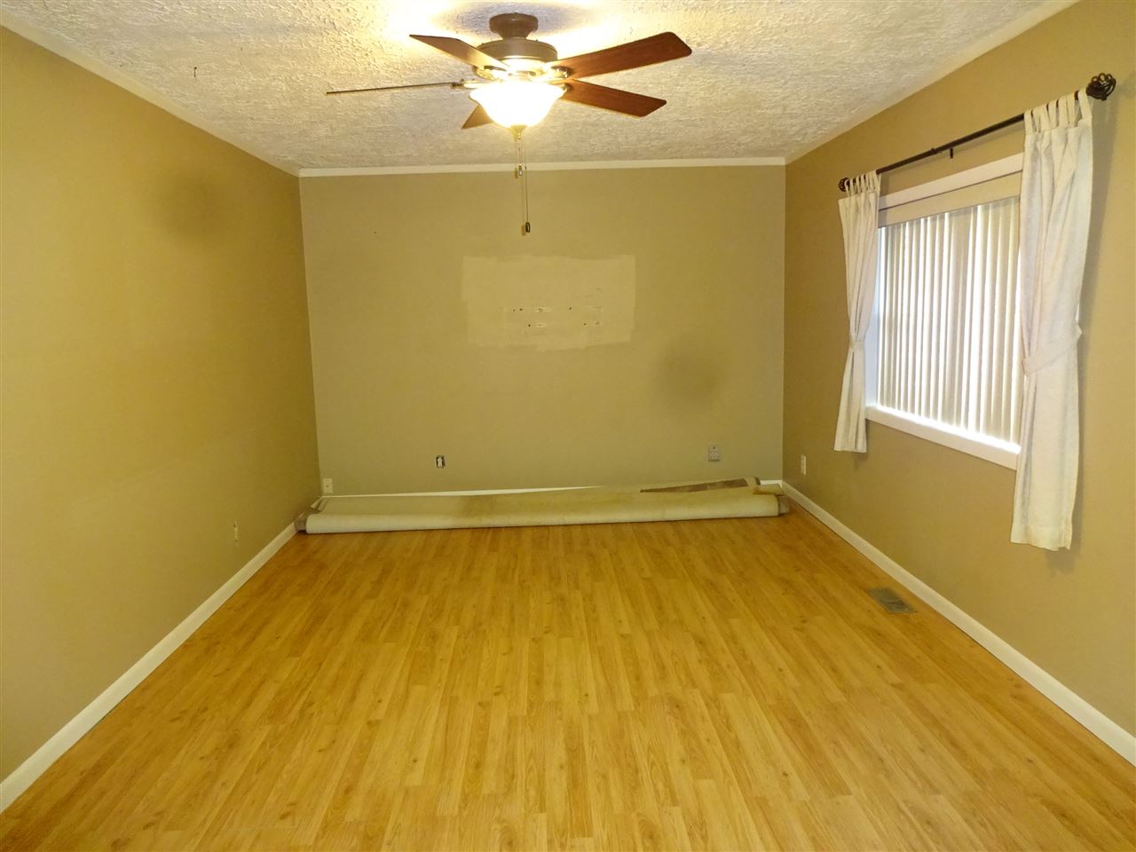 7707 Randy Road Machesney Park, IL 61115 - Photo 3 of 17 a view of a room with wooden floor and natural light