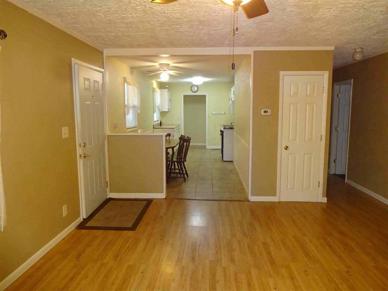 7707 Randy Road Machesney Park, IL 61115 - Photo 4 of 17 a view of a hallway with wooden floor