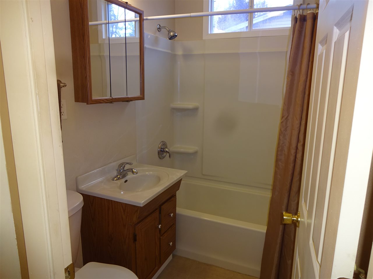7707 Randy Road Machesney Park, IL 61115 - Photo 9 of 17 a bathroom with a sink and a mirror