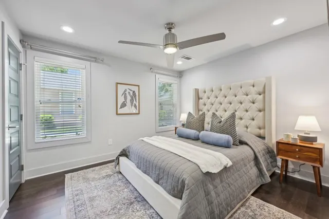 a bedroom with a large bed and a window