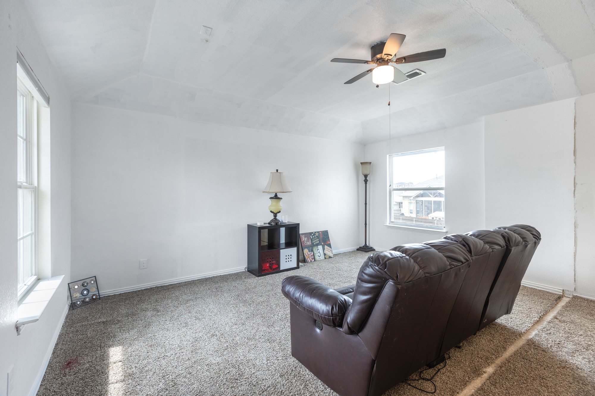 263 Joseph Drive Buda, TX 78610 - Photo 15 of 27 a living room with furniture a ceiling fan and a window