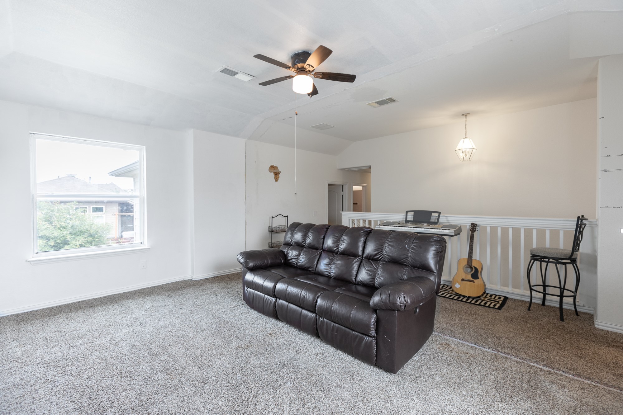 263 Joseph Drive Buda, TX 78610 - Photo 16 of 27 a living room with furniture and a window