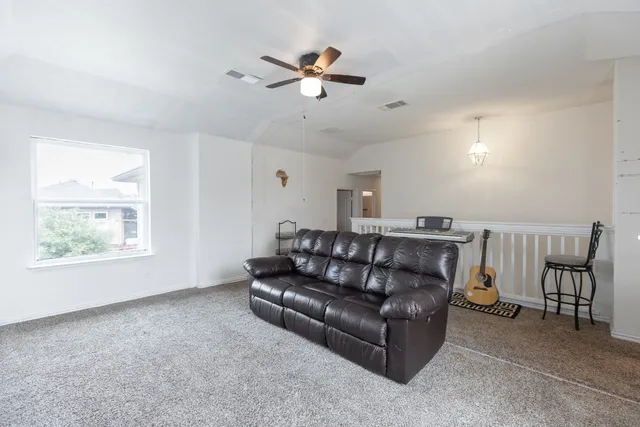 a living room with furniture and a window