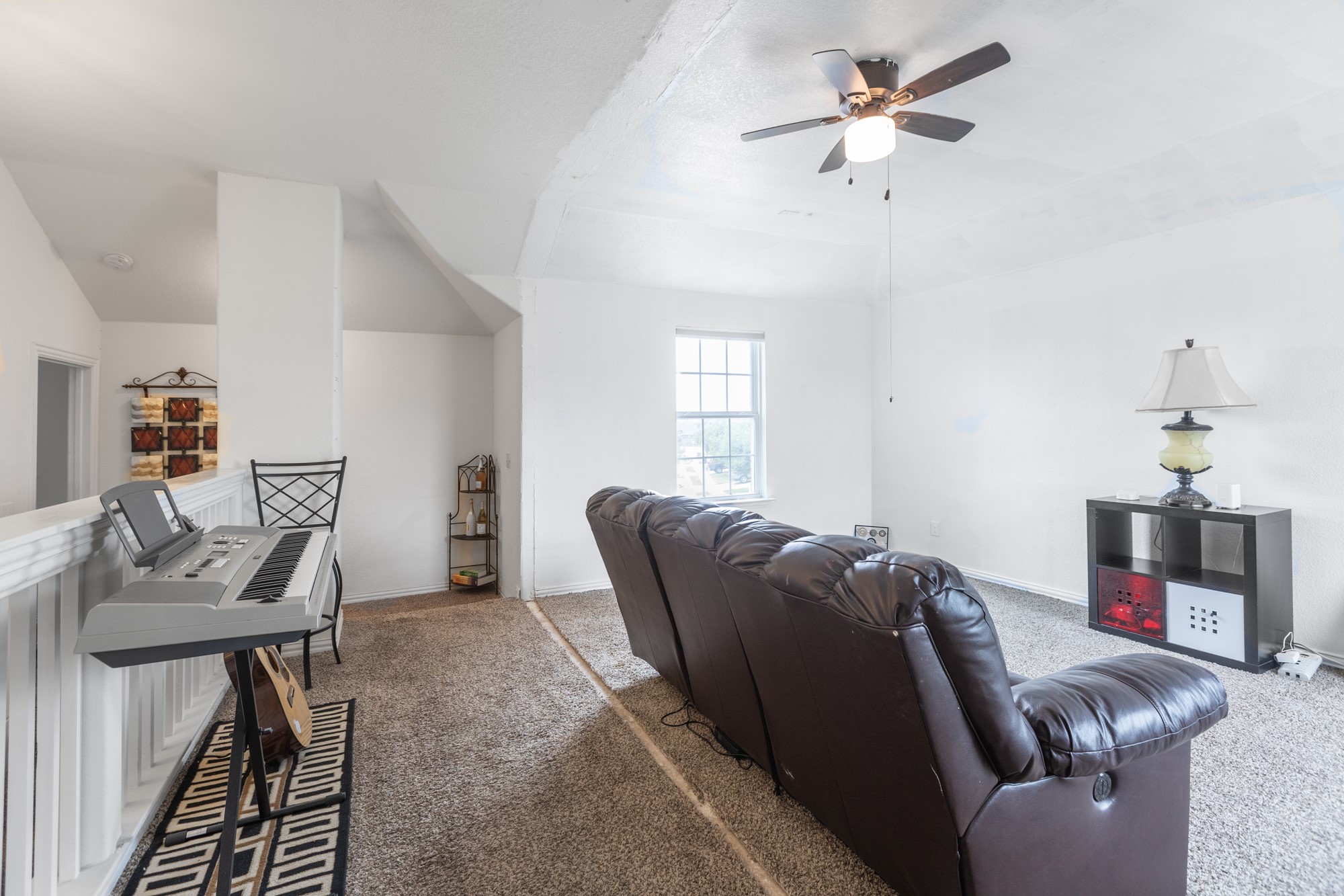 263 Joseph Drive Buda, TX 78610 - Photo 17 of 27 a living room with furniture a flat screen tv and a window
