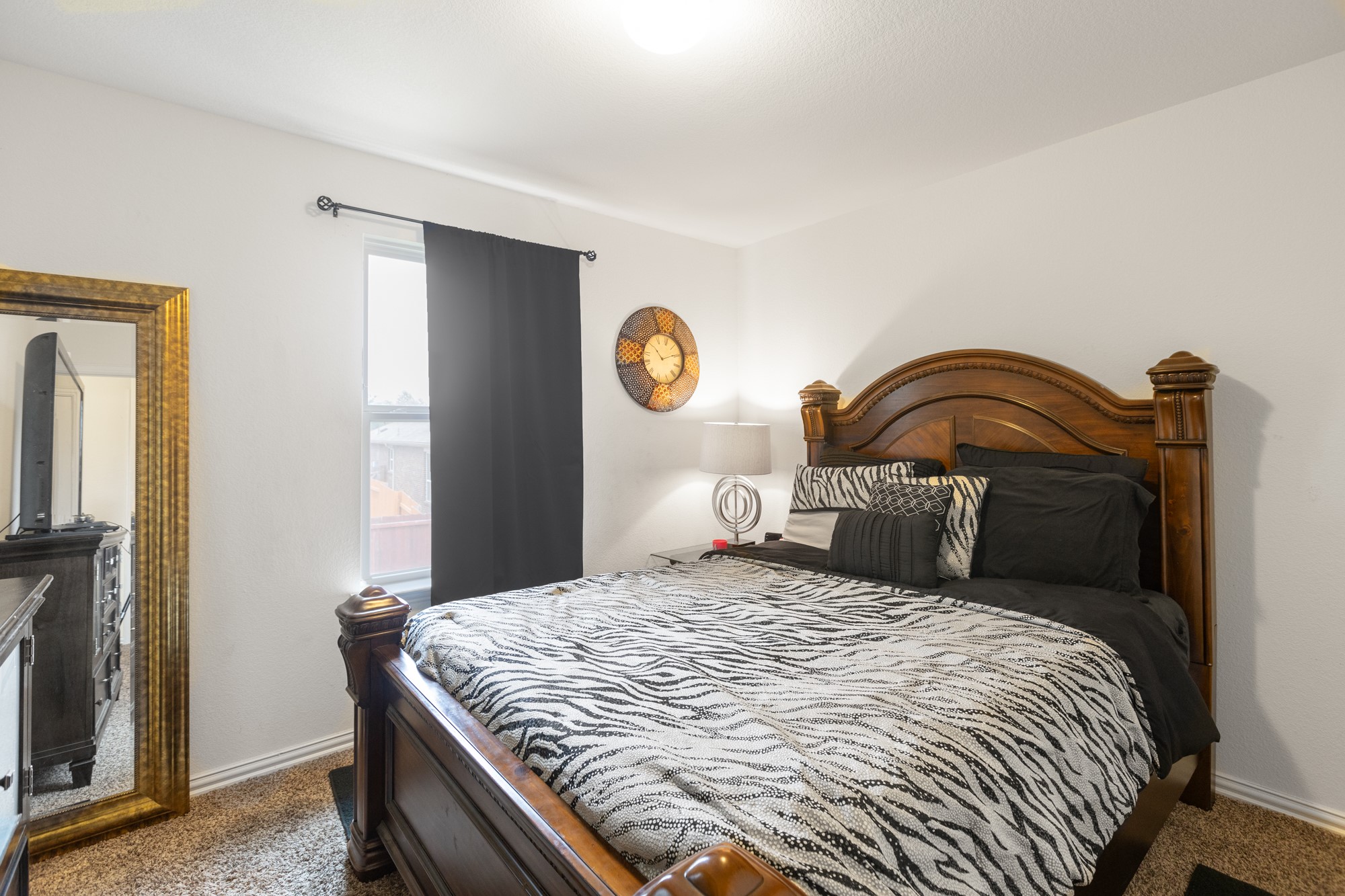 263 Joseph Drive Buda, TX 78610 - Photo 20 of 27 a bedroom with a bed and a mirror