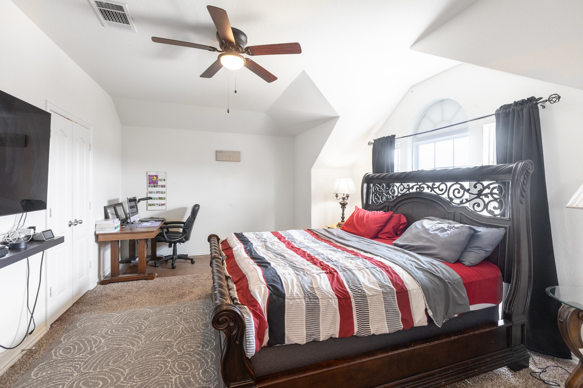263 Joseph Drive Buda, TX 78610 - Photo 21 of 27 a bedroom with a bed and a chandelier