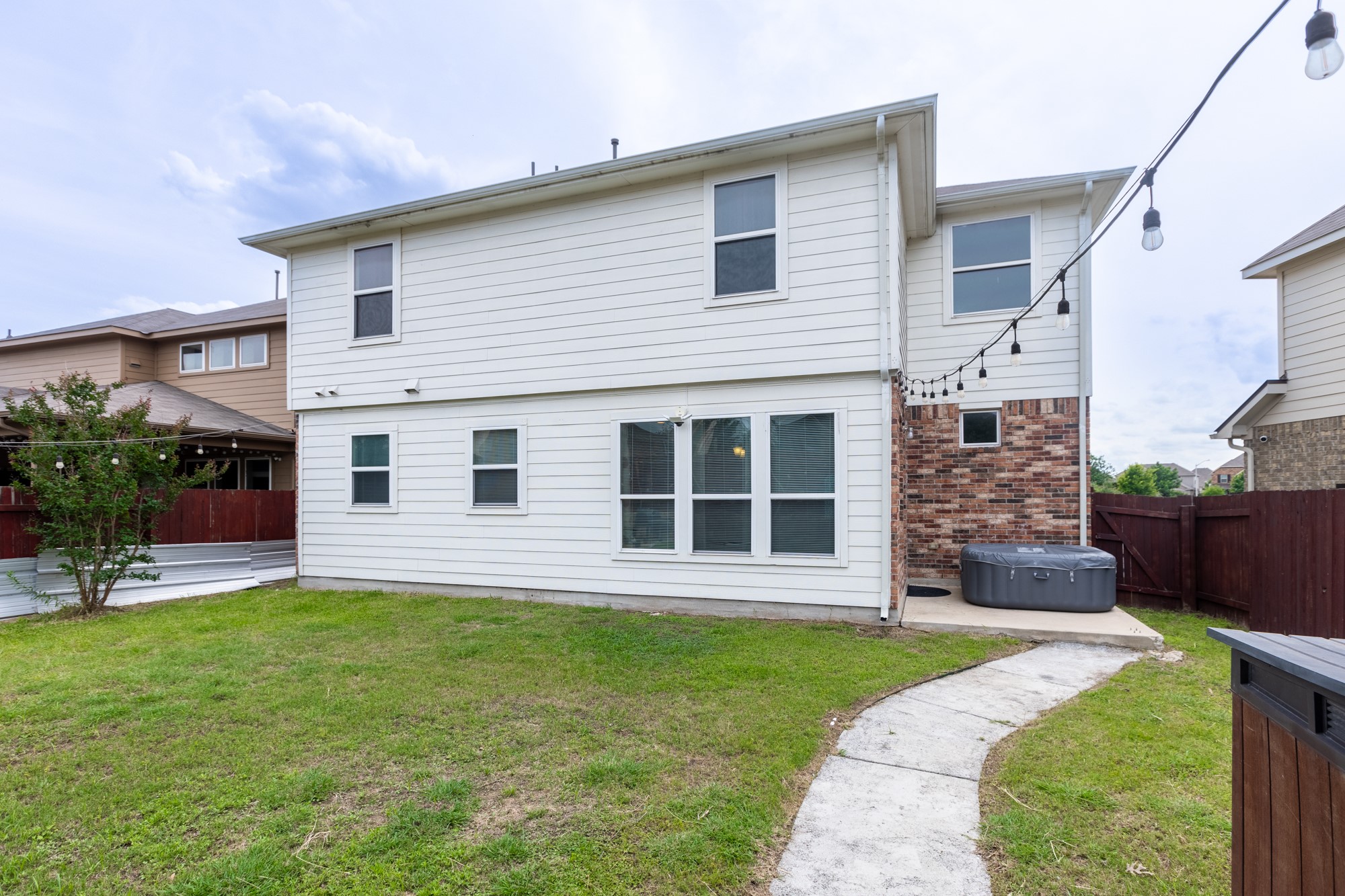 263 Joseph Drive Buda, TX 78610 - Photo 25 of 27 a view of a house with a yard and plants