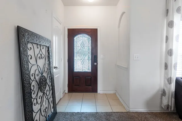 a view of front door with wooden floor