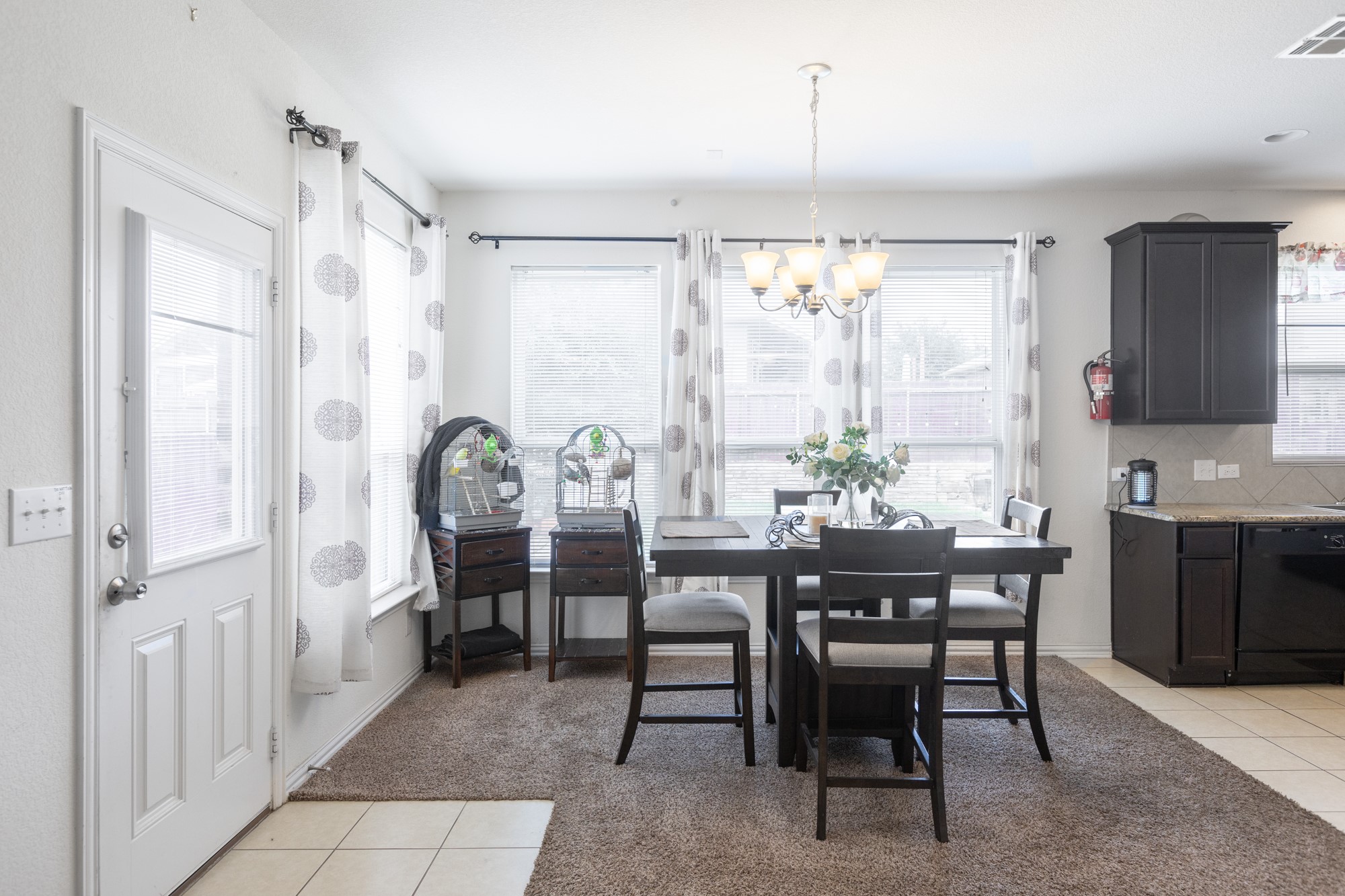 263 Joseph Drive Buda, TX 78610 - Photo 9 of 27 a view of a a dining room with furniture window and wooden floor