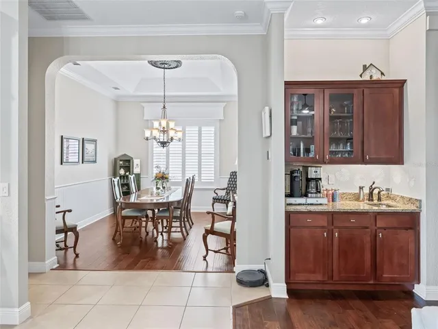 a living room with furniture and kitchen view