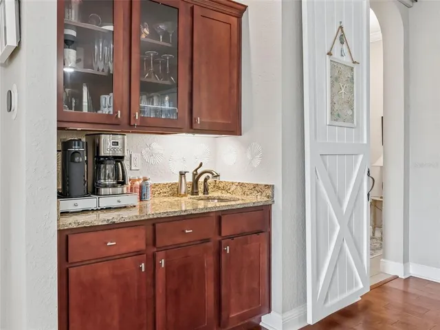 a spacious bedroom with a bed a couch and a window