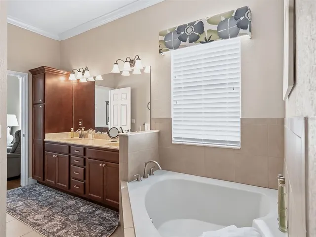 a kitchen with stainless steel appliances granite countertop a sink and a refrigerator