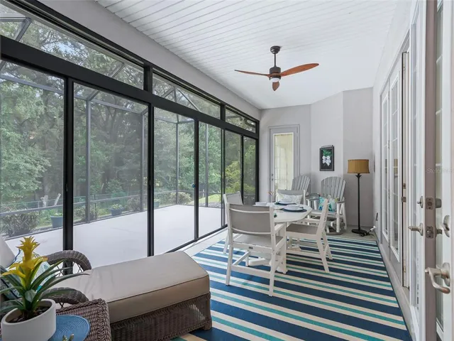 a swimming pool with outdoor seating and yard