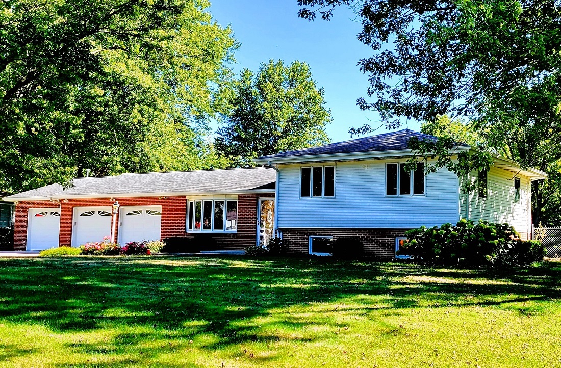 23885 Hazel Road Sterling, IL 61081 - Photo 1 of 48 a aerial view of a house with a yard table and chairs