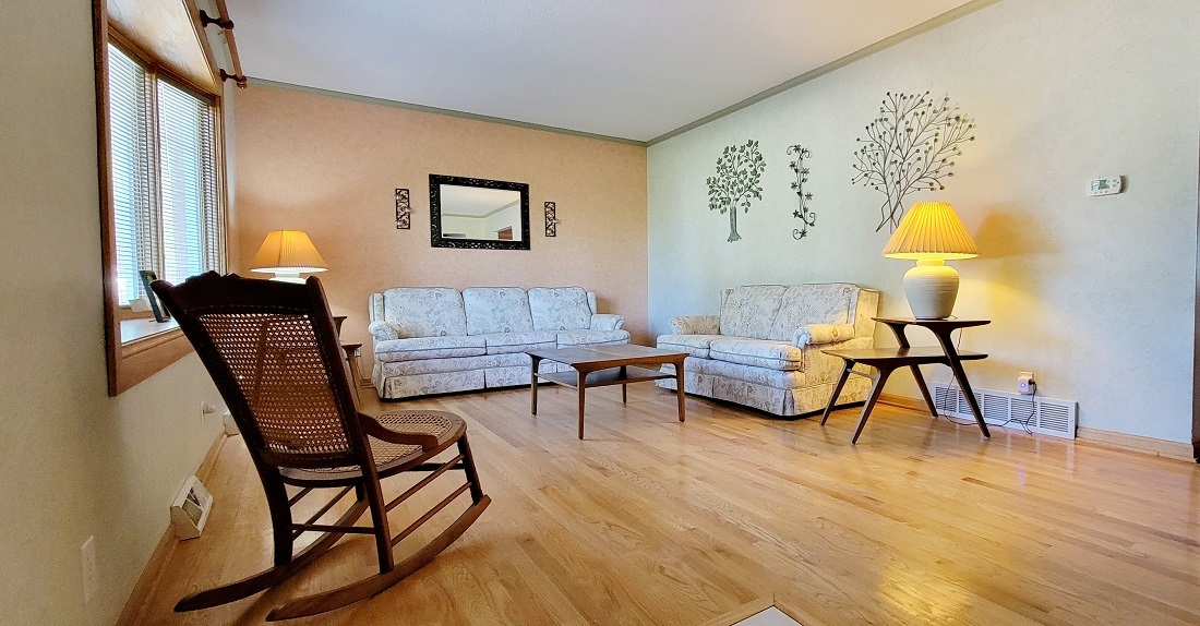 23885 Hazel Road Sterling, IL 61081 - Photo 5 of 48 a living room with furniture and a wooden floor