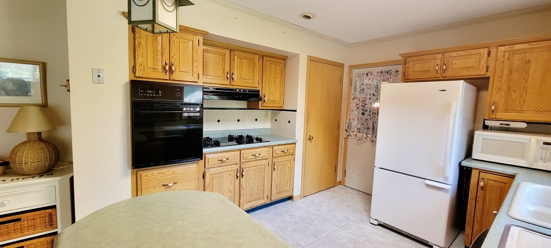 23885 Hazel Road Sterling, IL 61081 - Photo 8 of 48 a kitchen with stainless steel appliances a refrigerator a stove a microwave and cabinets