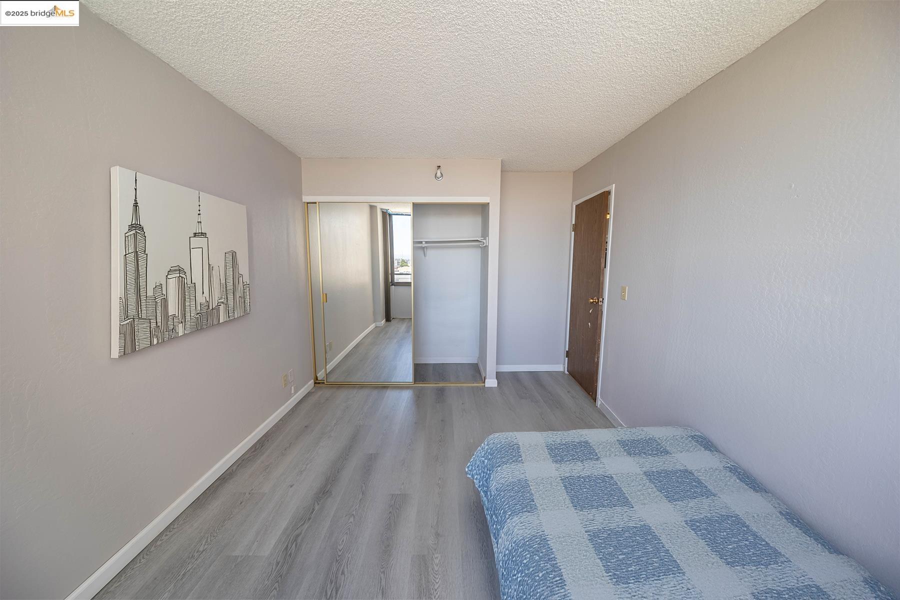801 Franklin Street, Unit 819 Oakland, CA 94607 - Photo 3 of 9 a view of livingroom with hardwood floor and hallway